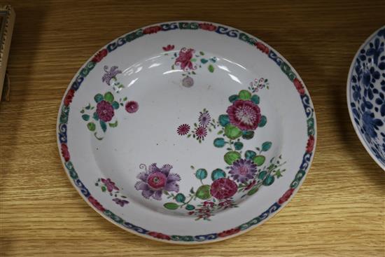 Three Chinese blue and white dishes and a famille rose bowl largest measurement 24cm diameter